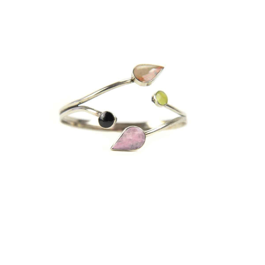 A silver bracelet with semi-precious stone leaves on a white background.