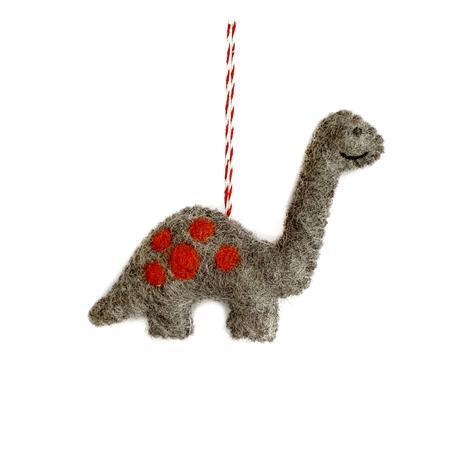 A felt wool ornament in the shape of a dinosaur with a colorful pattern, hanging by a string.