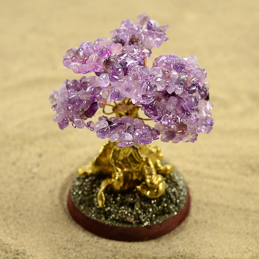 a amethyst stone tree on a circular base