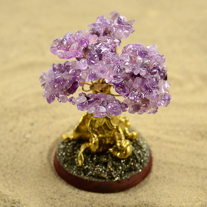 a amethyst stone tree on a circular base