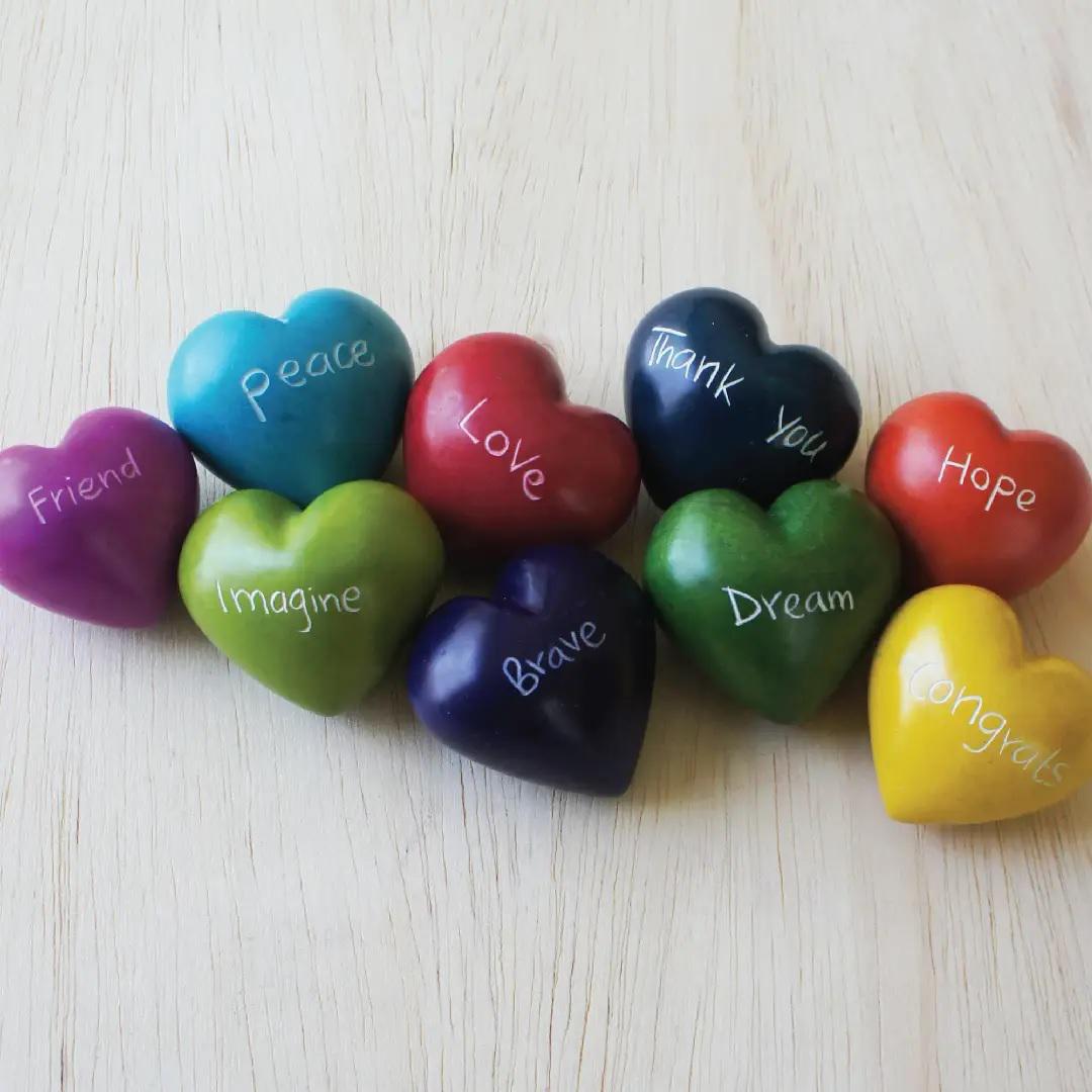 A collection of colorful kisii hearts on a white background