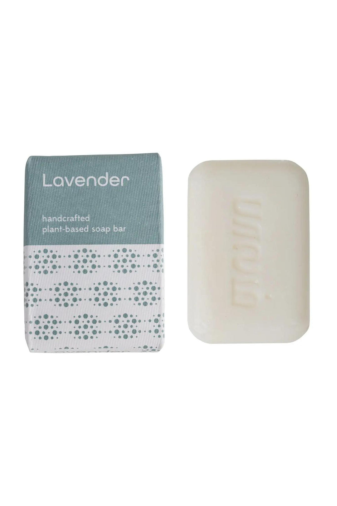 A rectangular lavender-colored bar soap next to its packaging, which has a geometric pattern.