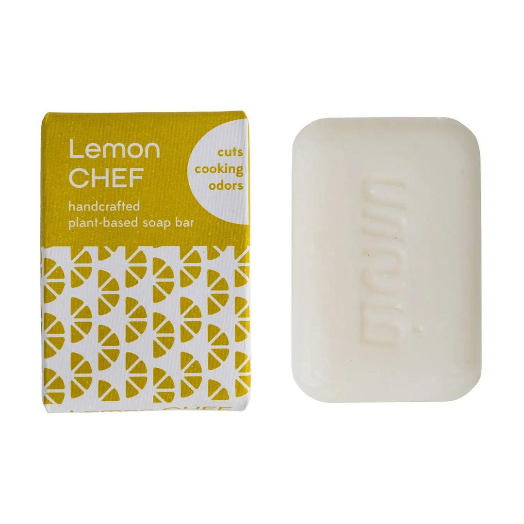 A bar of soap with a yellow label that reads 'LEMON CHEF' and a patterned design, alongside its packaging.