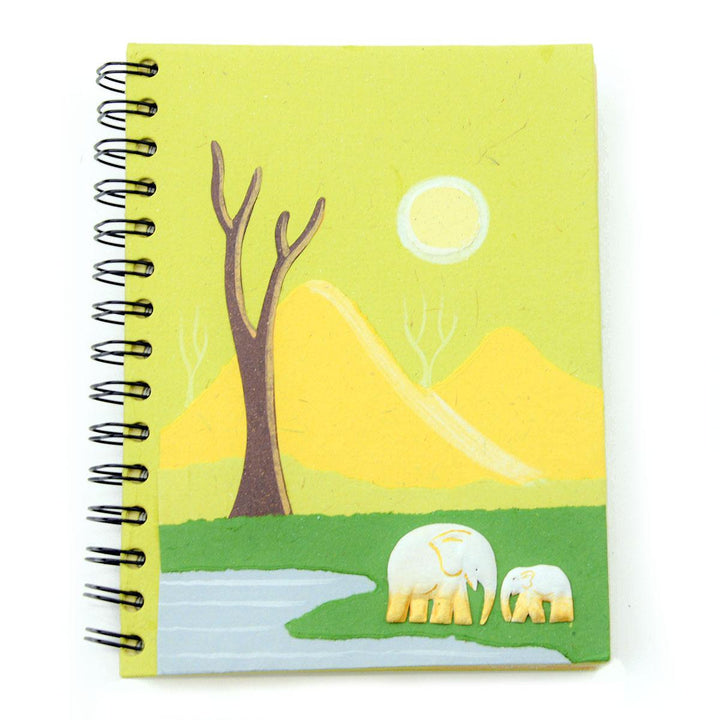 a light green Mr. Ellie Pooh notebook with two small elephants