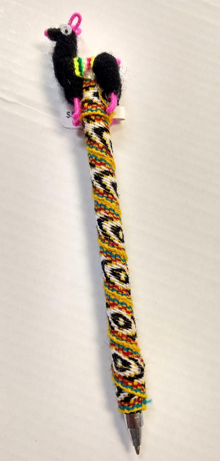 a llama pen on a off white background