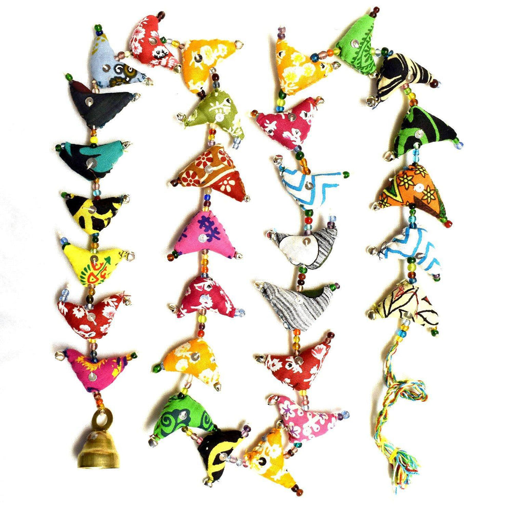 A collection of colorful handmade hanging decorations consisting of cotton fabric and beads, with a brass bell attached to each end.