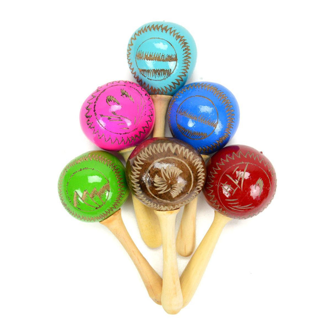 A set of colorful hand percussion instruments known as maracas, featuring wooden handles and brightly painted gourd bodies in various colors.