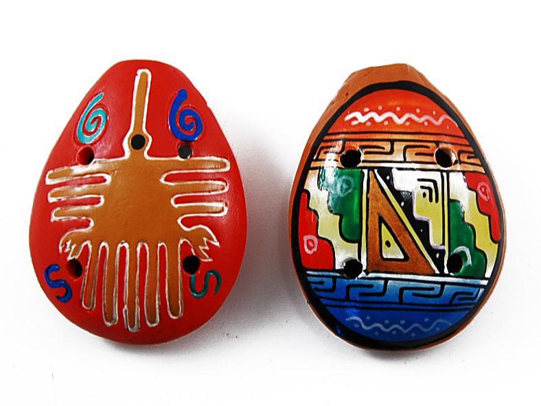 A pair of painted ocarinas with traditional Andean motifs in red, orange, and blue colors on a white background.