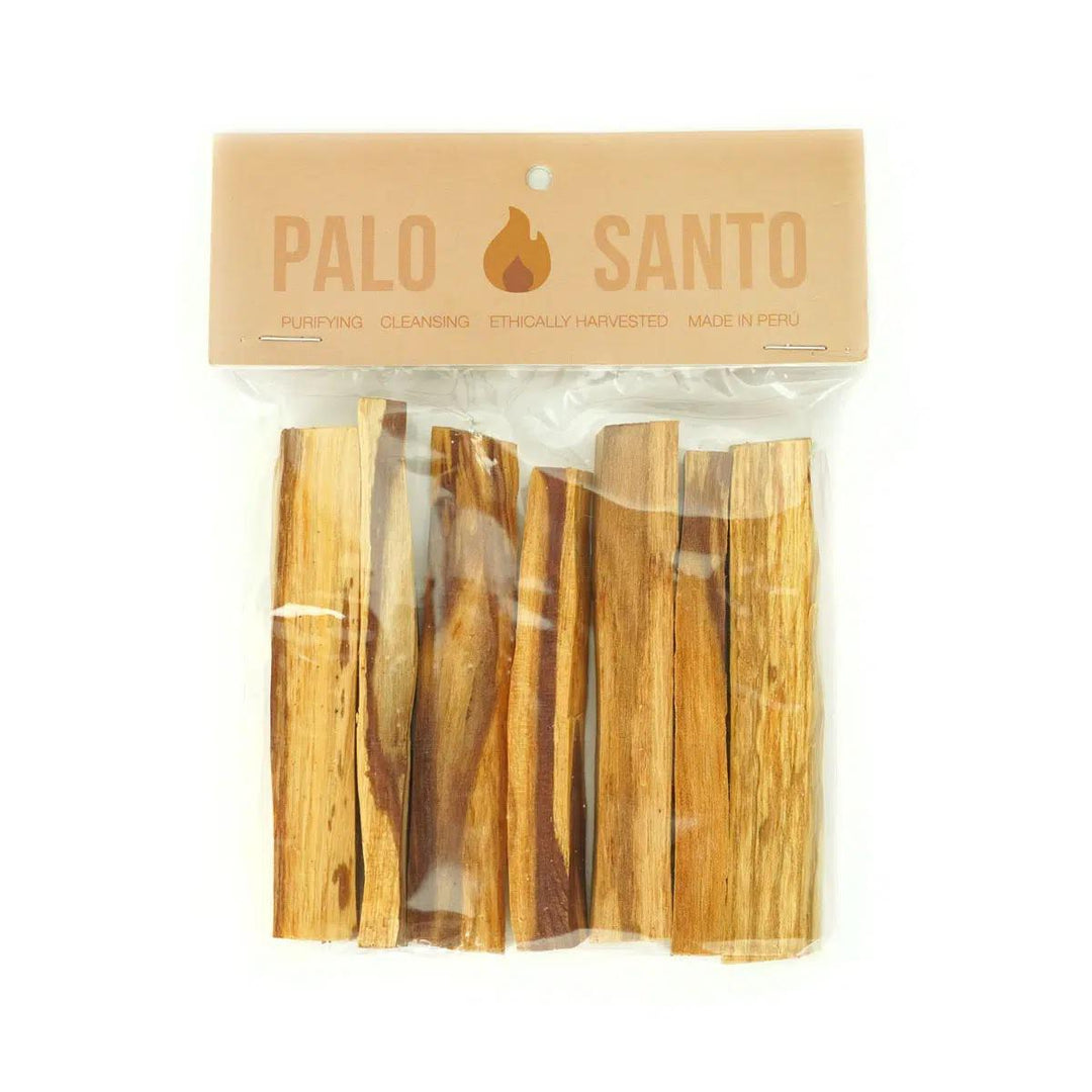 A pack of Palo Santo smoking sticks, with each stick visible through the clear plastic packaging. The packaging has a beige background with the 'Palo Santo' branding and a description of the product.