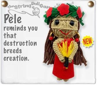Handmade string doll wearing a red dress and grass crown holding a fire lantern.