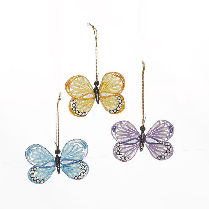 Three quilled butterflies on a white background