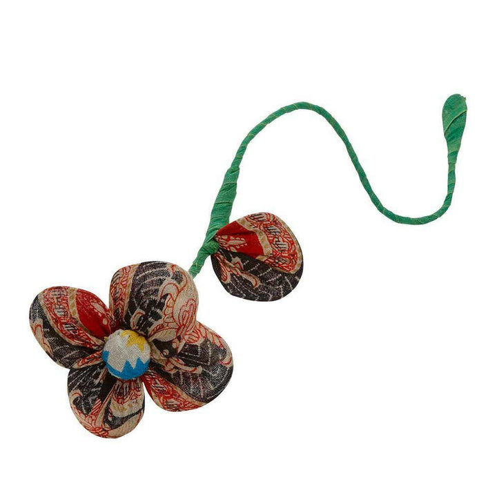 One recycled sari flower on a white background 