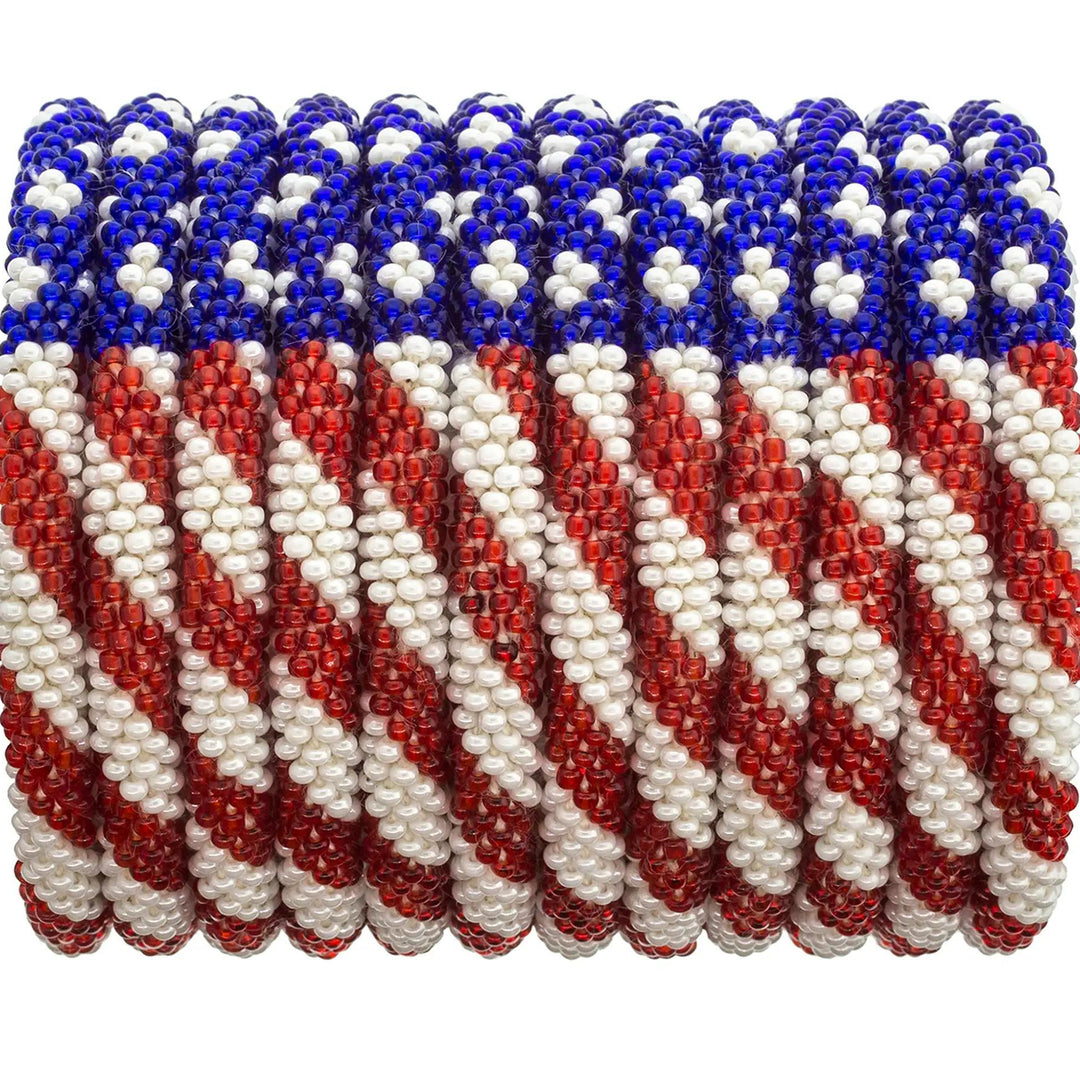 Beaded roll-on bracelets with a stars and stripes pattern displayed on a roll.