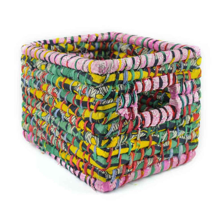 a sari wrapped basket on a white background