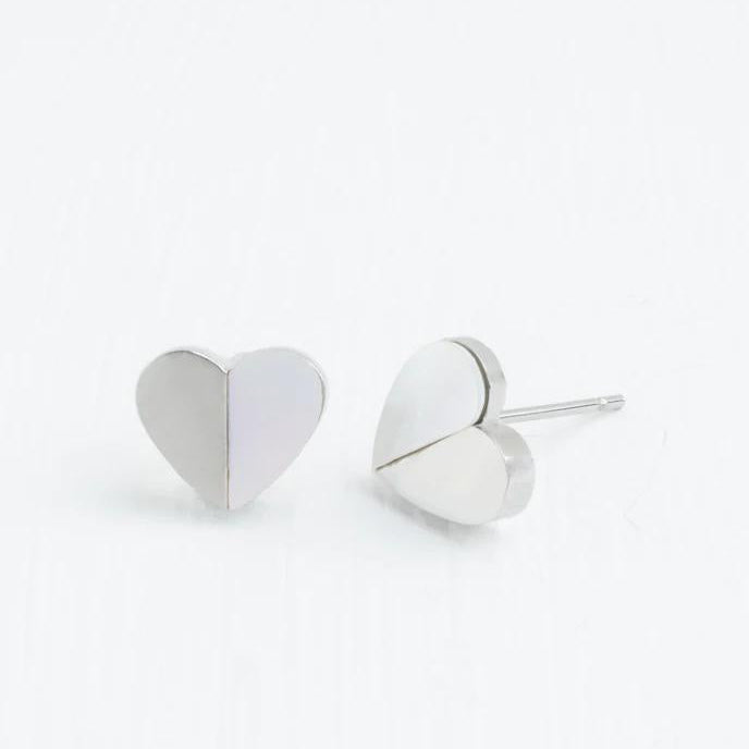 A pair of silver heart-shaped earrings on a white background.