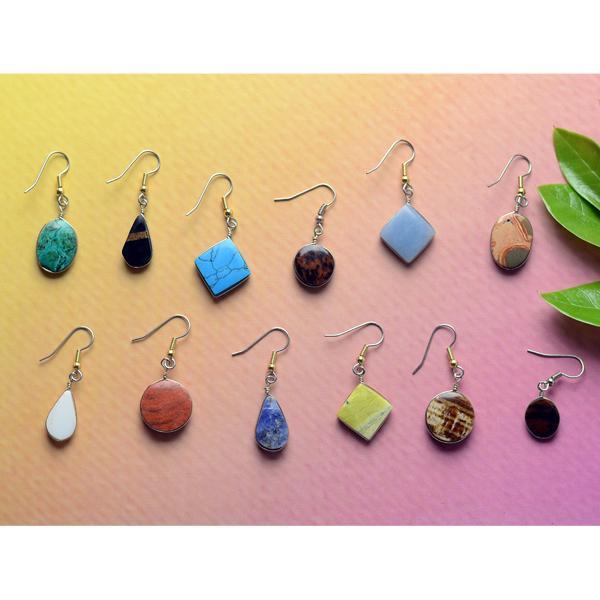 a collection of semi precious stone dangle earrings