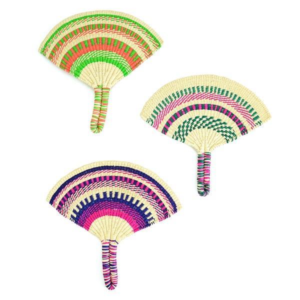 A set of three straw hand fans with colorful geometric patterns.