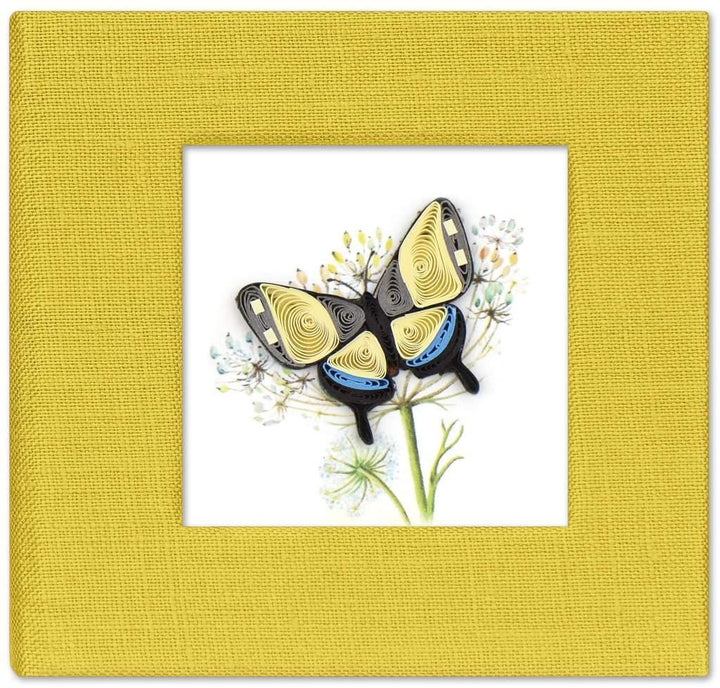 A handcrafted red sticky note cover with a quilled swallowtail butterfly design on the front, made of paper, displayed against a white background.