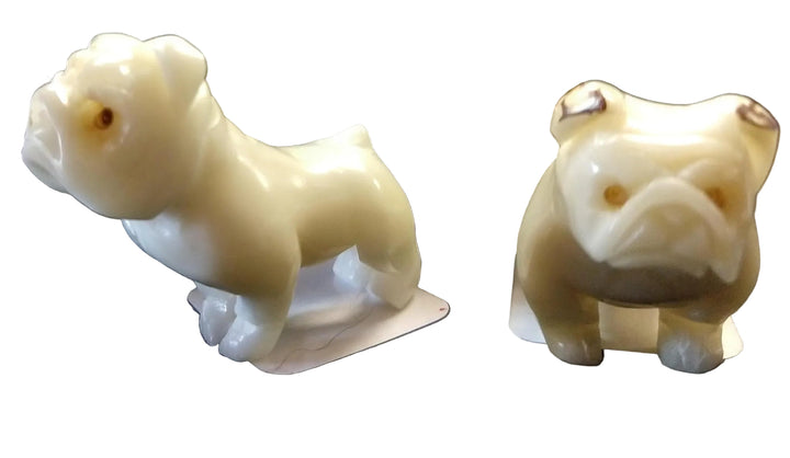 two hand carved tagua nut bulldogs 