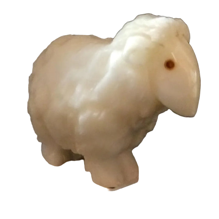 A hand-carved white tagua nut figurine of a sheep