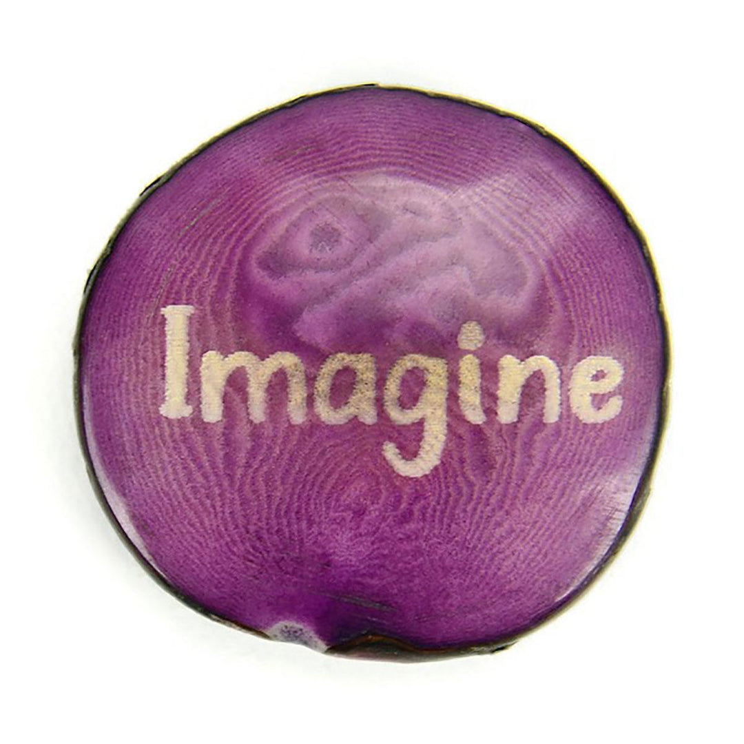 a purple tagua nut with the word 'imagine'