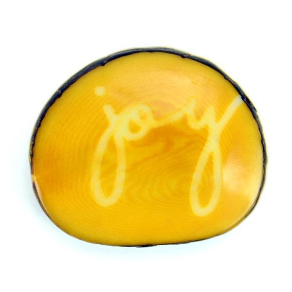 Tagua nut with the word 'joy'