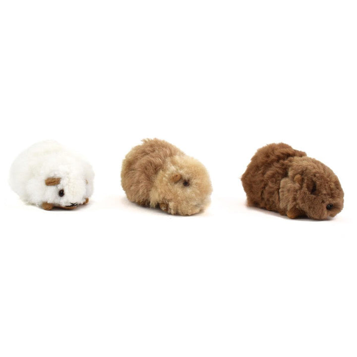three alpaca guinea pigs made from alpaca fur.