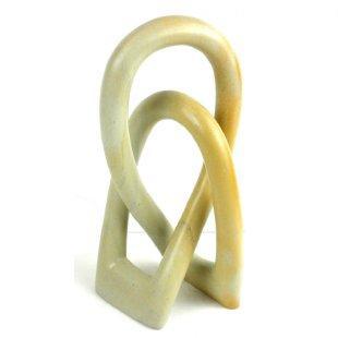 A Soapstone wedding sculpture on a white background 
