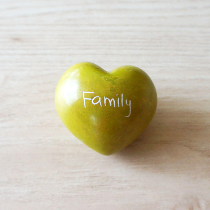 A yellow kisii family heart on a wooden background 